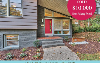 Gray brick split level home with hot pink front door gray siding